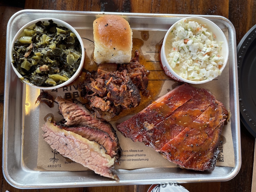 BBQ platter at 4 Rivers Smokehouse Middleton with brisket, ribs, and burnt ends