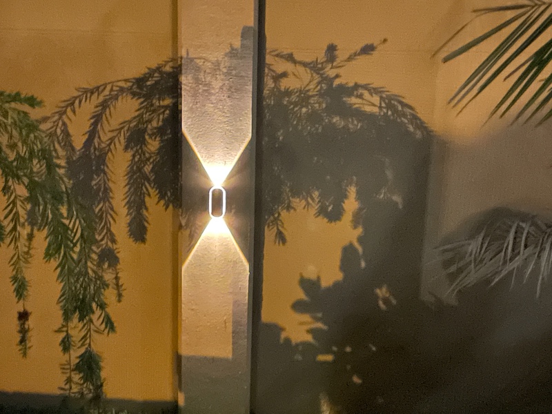 Ellasay Solar Fence Light illuminating fence at night in The Villages