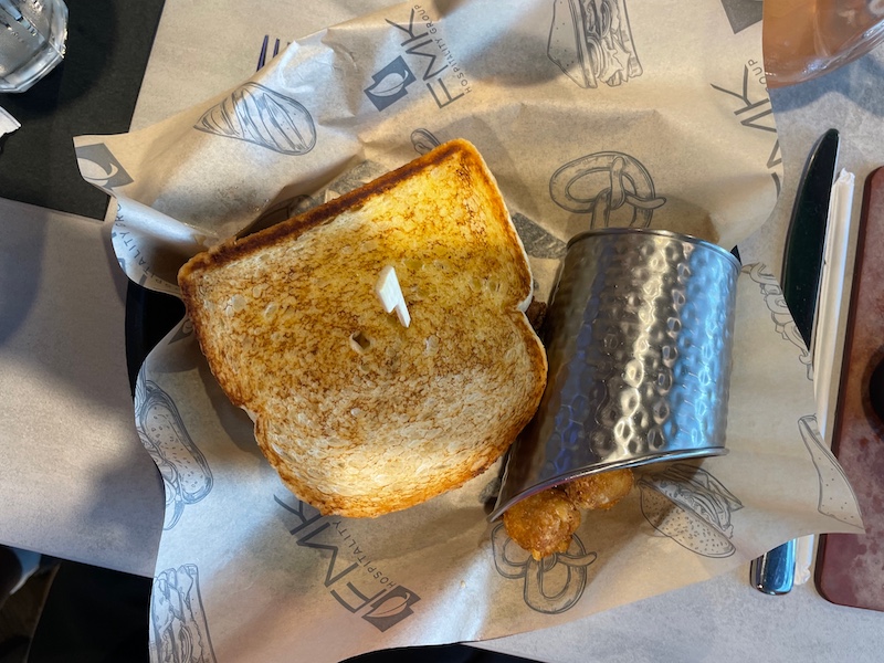 Sourdough Smash Burger with Swiss cheese and toasted sourdough bread.