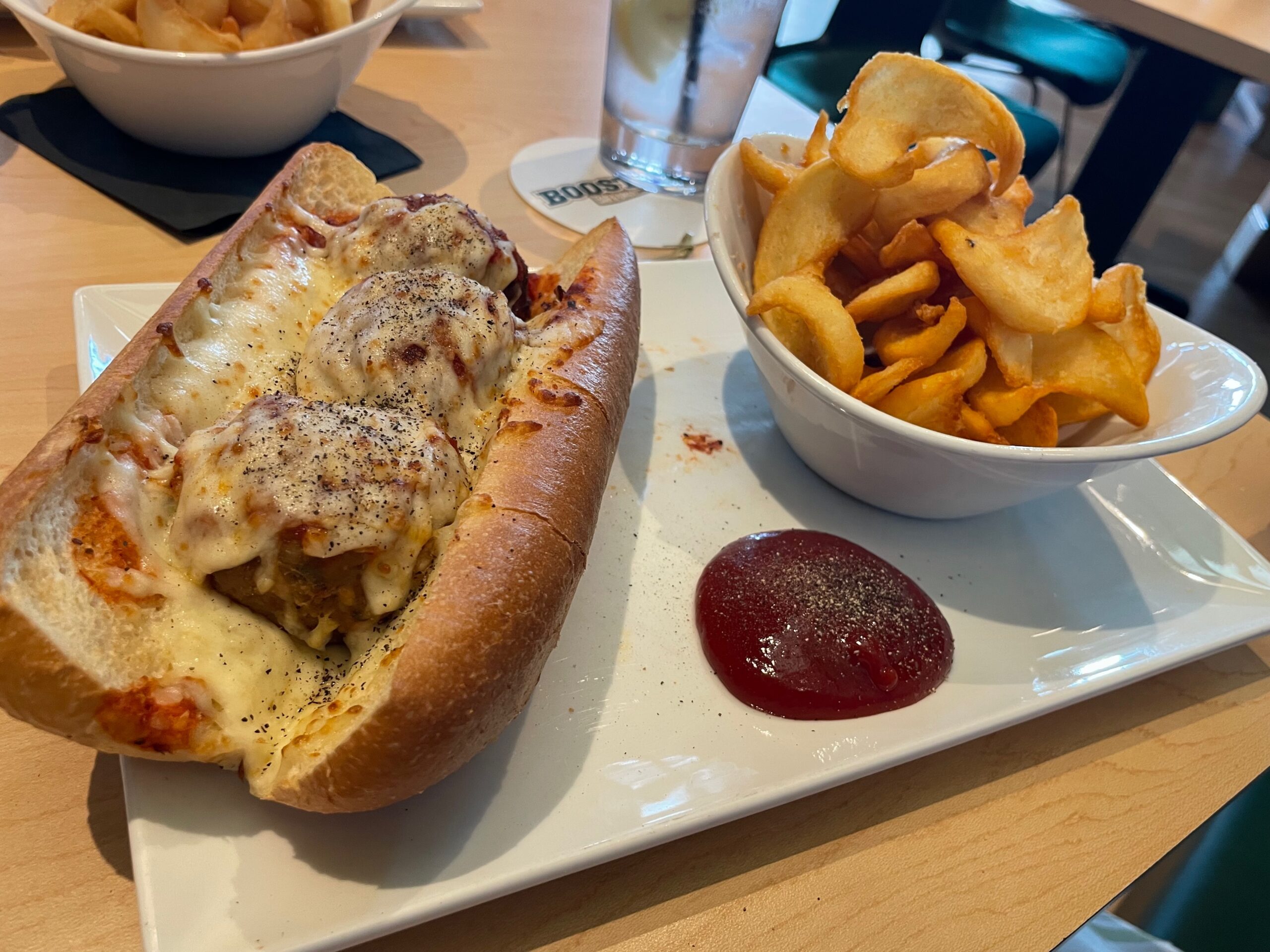 Meatball sub with marinara sauce and melted mozzarella cheese