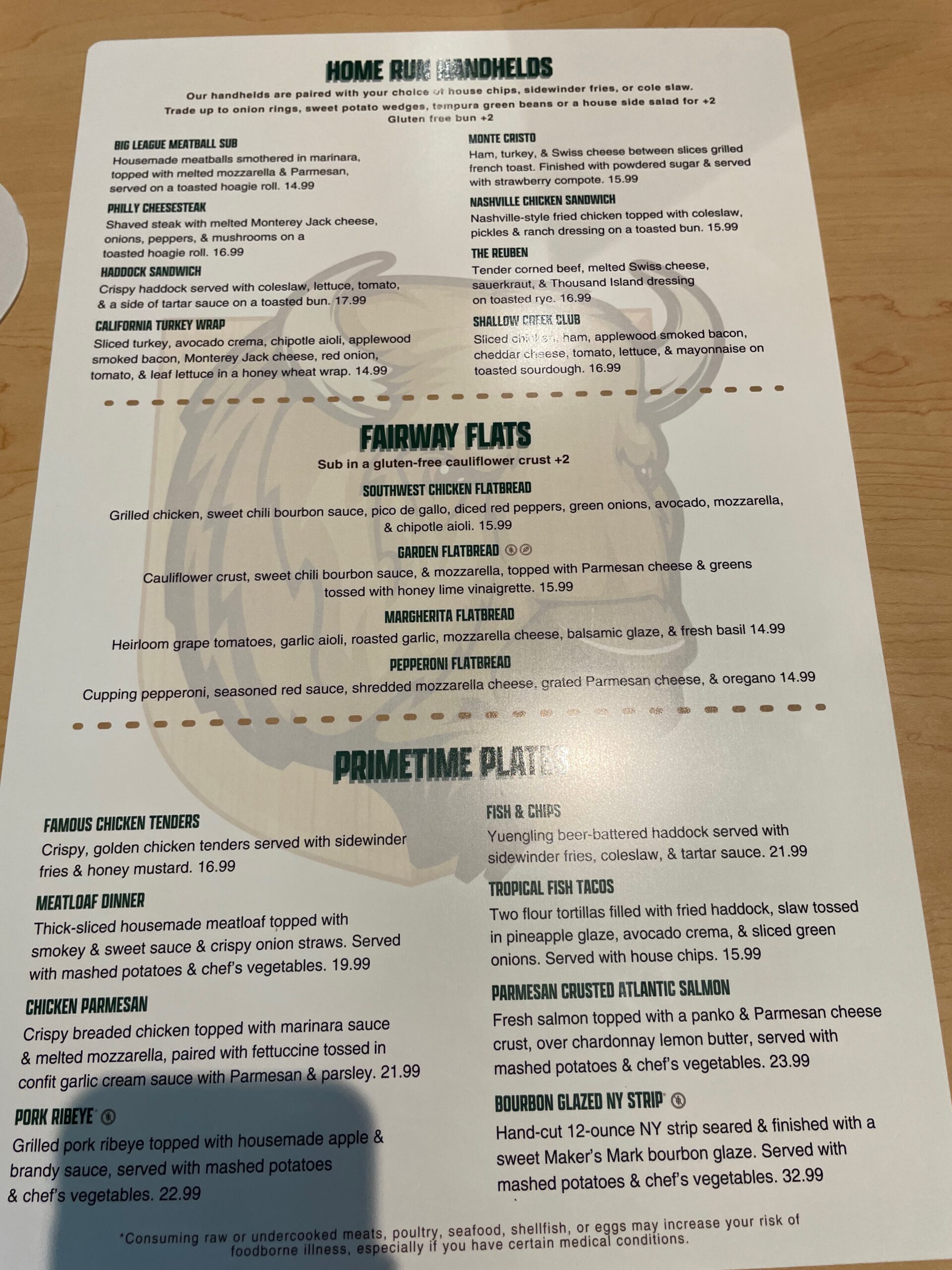 Menu featuring sandwiches, wraps, flatbreads, and entrées