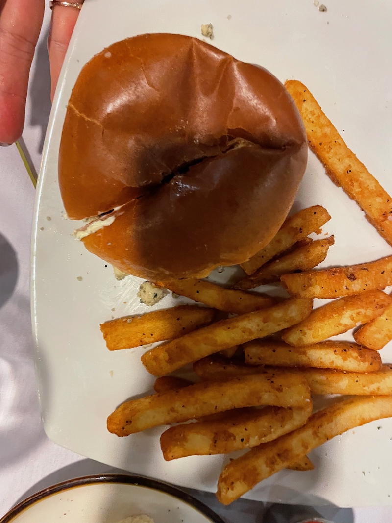 Mushroom gorgonzola burger served with fries