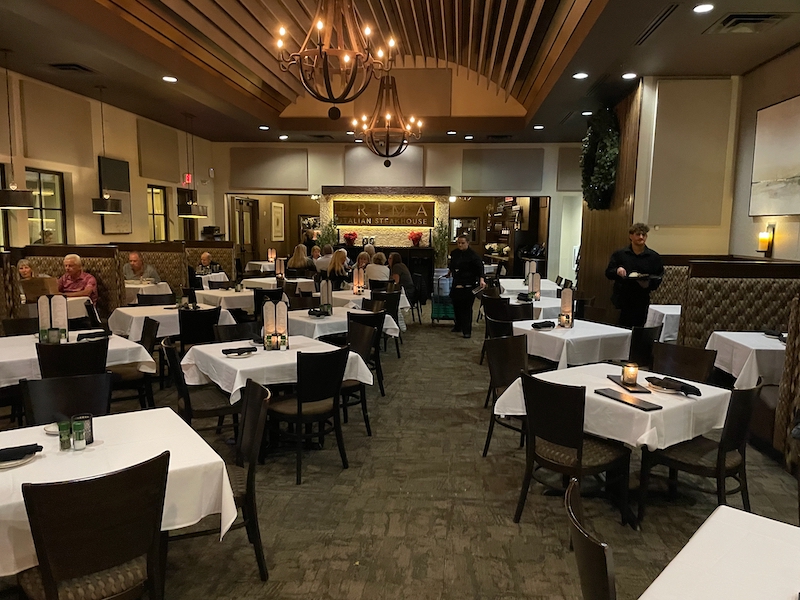 Dining room at Prima Italian Steakhouse with tables and guests
