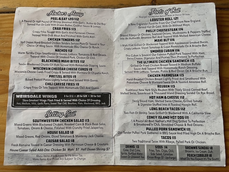 Printed menu at The Anchor showing burgers, starters, and sandwiches