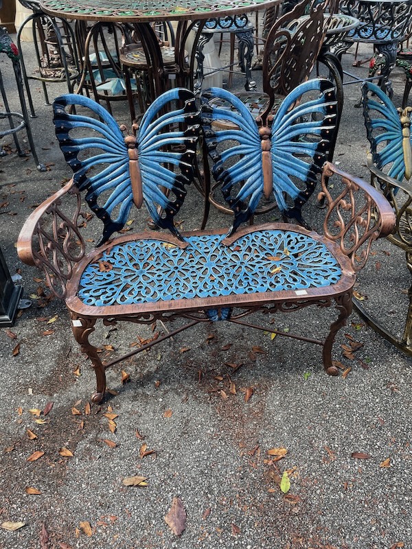 Decorative metal bench with butterfly design at Barberville Yard Art