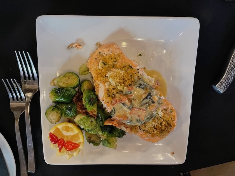 Salmon topped with crab and vegetables