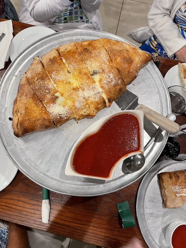 Large calzone with marinara sauce at Roberto’s Ristorante