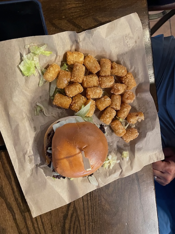 Burger and tots at the bar
