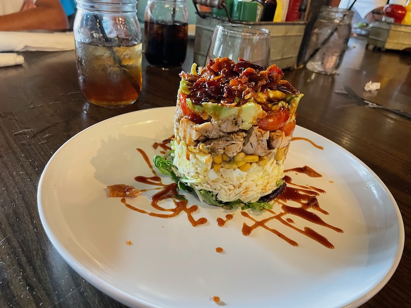 Stacked cobb salad with layered ingredients