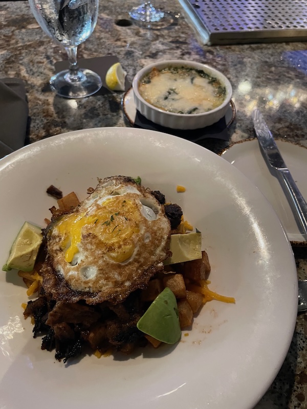 Brisket breakfast bowl with fried egg and avocado