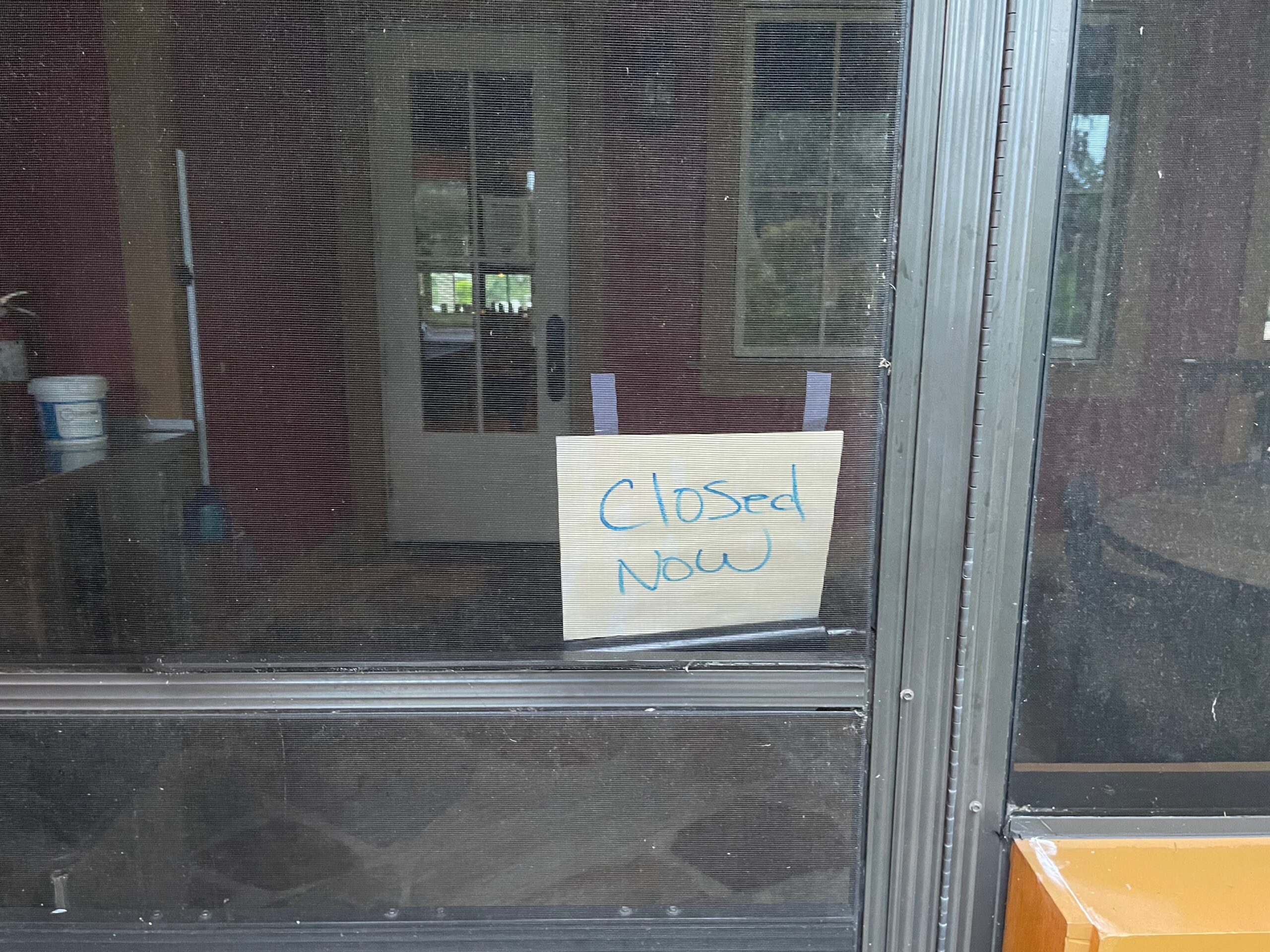 Closed Now notice displayed at an entrance to Fenney Grill