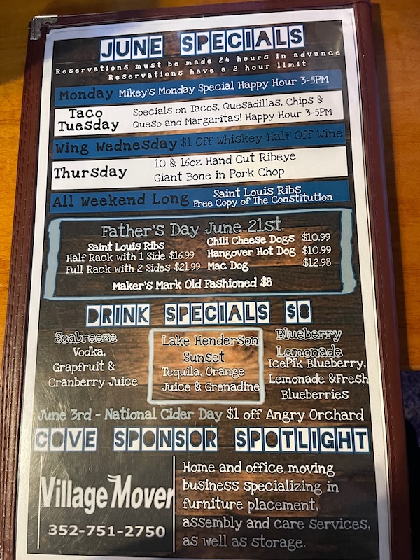 Weekly food and drink specials displayed at The Cove Resort and Pub