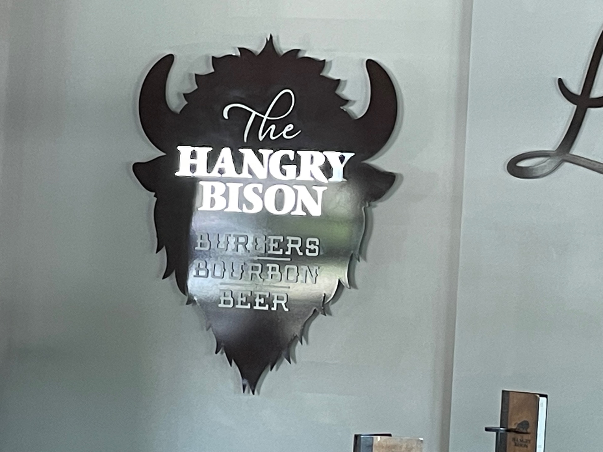 A wall sign inside The Hangry Bison