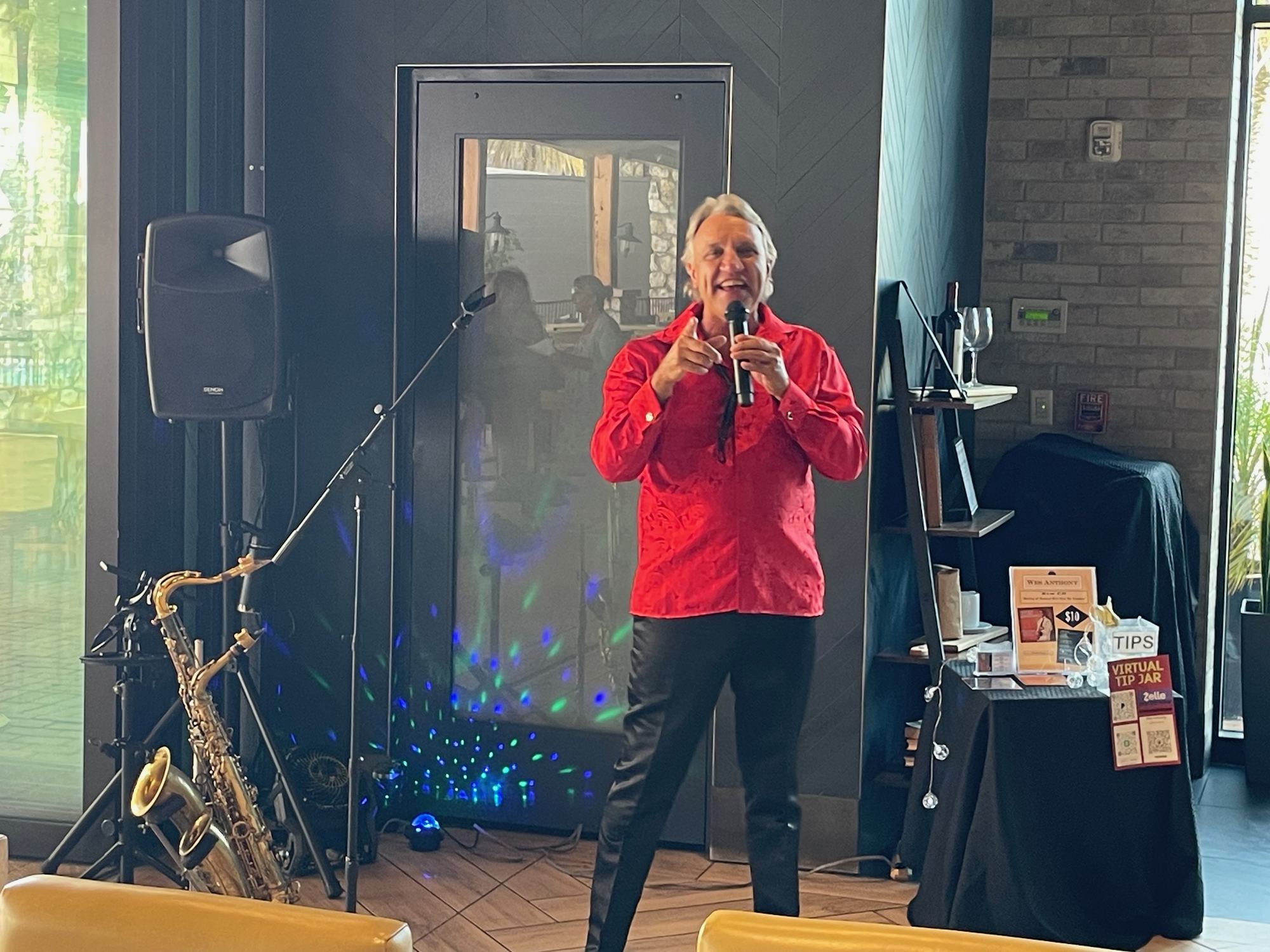 Wes Anthony performing live music in the bar area