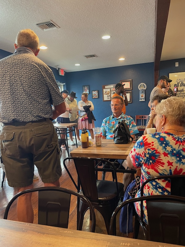 Customers lined up to order at the counter inside J&T Smokehouse in Leesburg