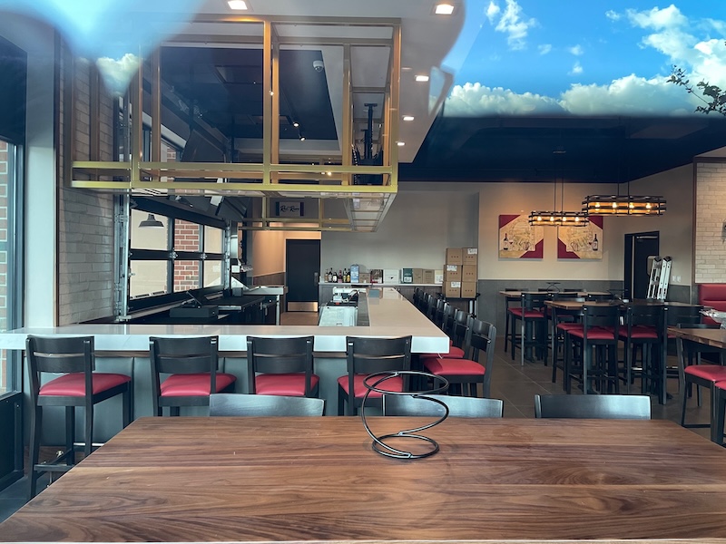 View through the window of Piesanos’ interior bar