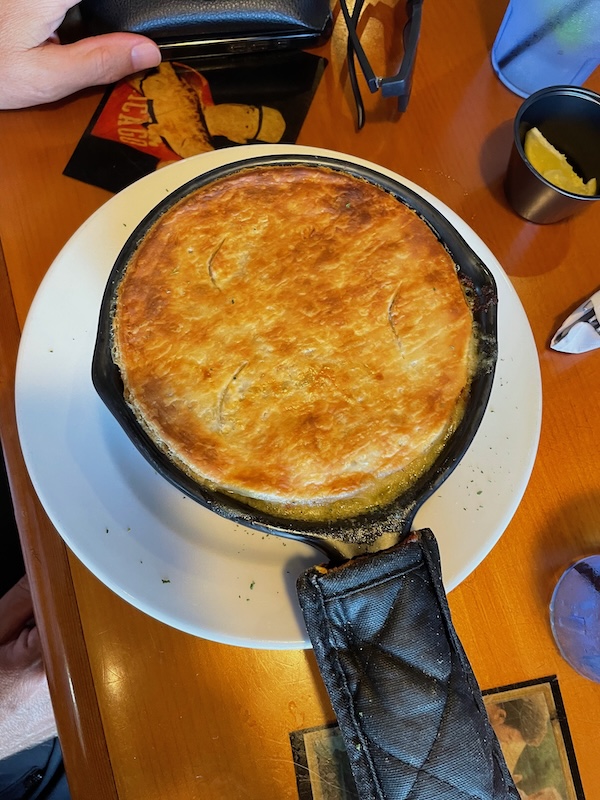 Chicken pot pie with a golden pastry crust served in a skillet at R.J. Gator’s Lake Sumter Landing