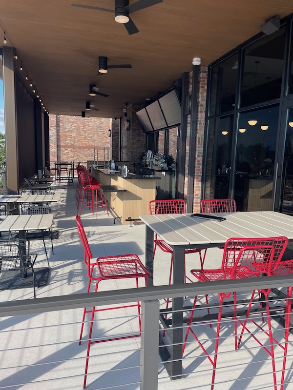 Woodrow’s covered patio with outdoor bar and seating